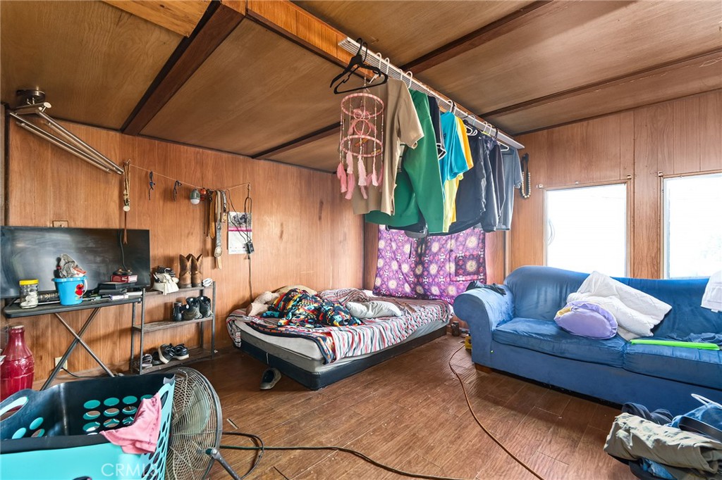 16925 Basler Road Cottonwood, CA 96022 - Photo 39 of 55 a bedroom with furniture a rug and a window