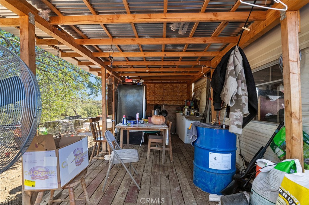 16925 Basler Road Cottonwood, CA 96022 - Photo 40 of 55 a view of a chairs and table in a patio