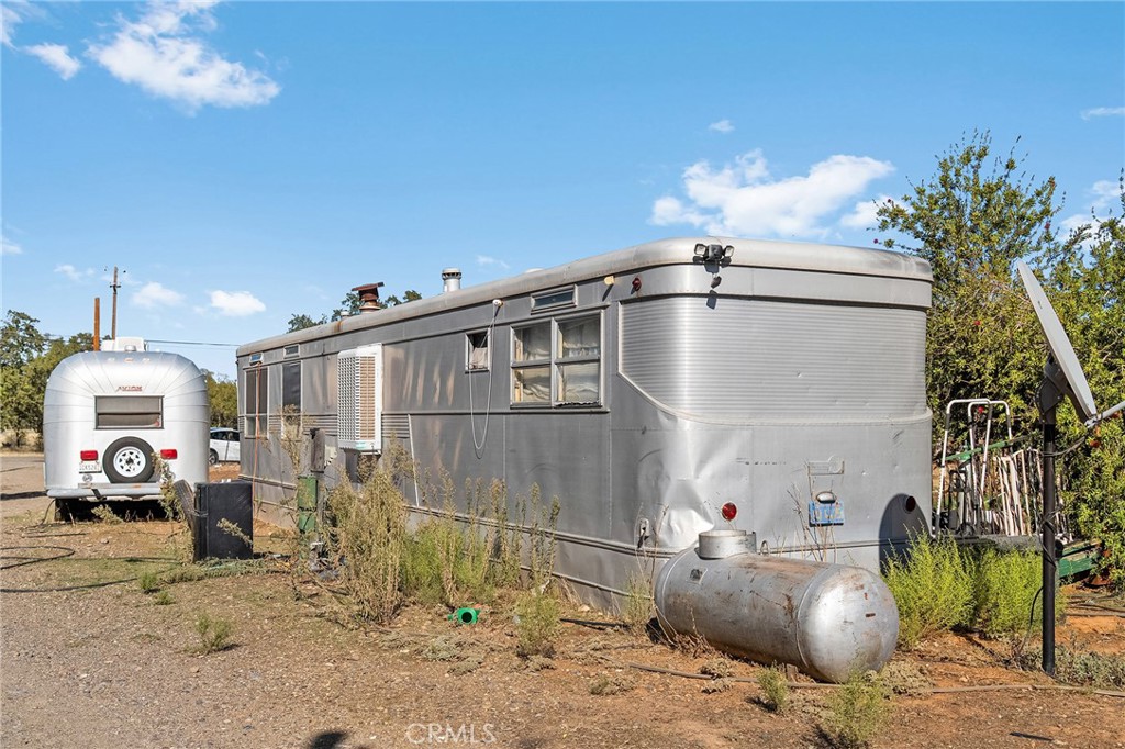 16925 Basler Road Cottonwood, CA 96022 - Photo 42 of 55 a kitchen with sink cabinets and chandelier