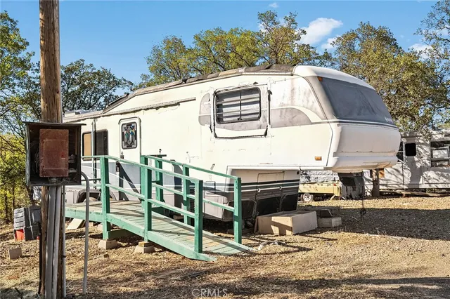 a view of a yard with table and chairs