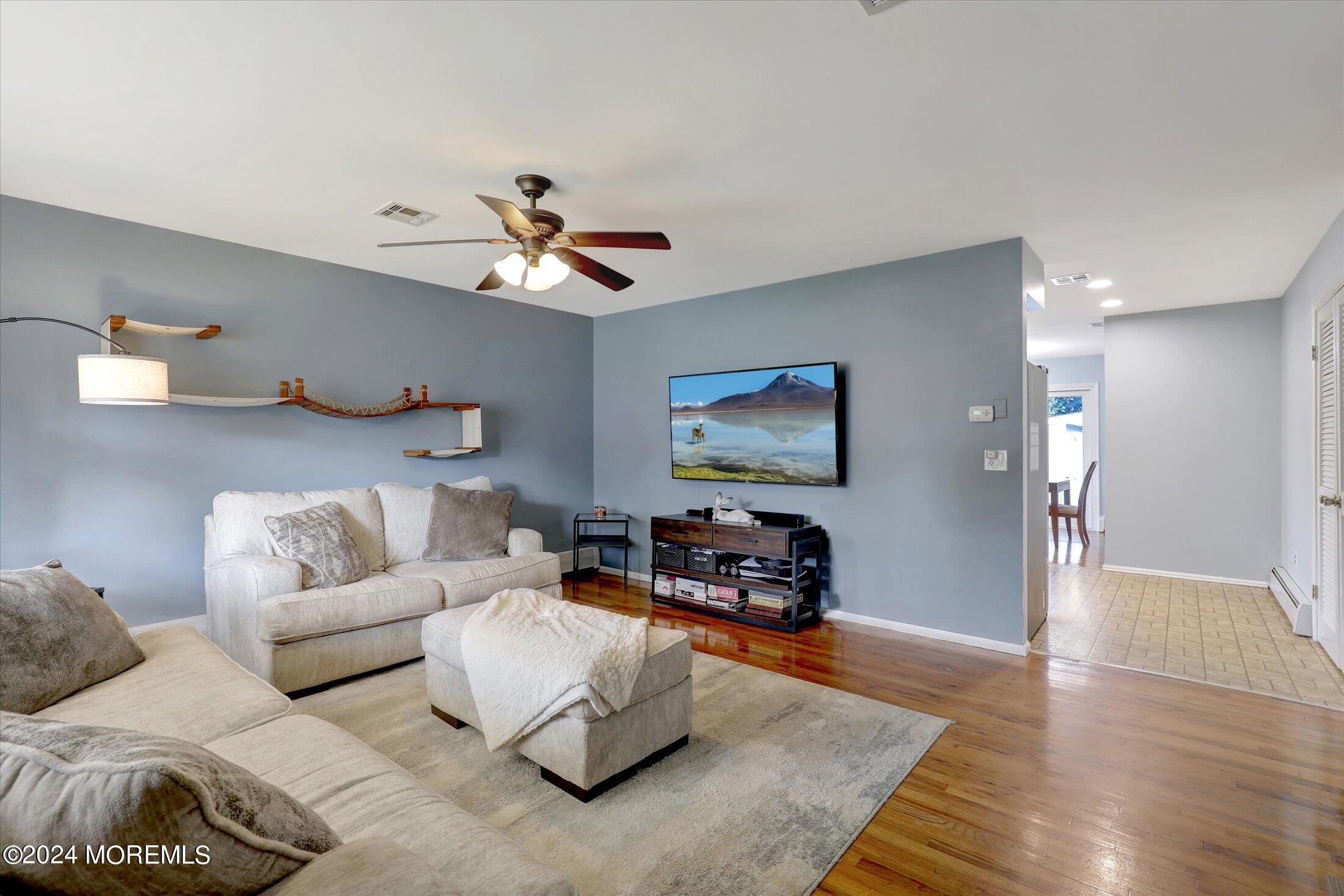 25 Hulse Landing Road Brick, NJ 08723 - Photo 4 of 28 a living room with furniture and a flat screen tv