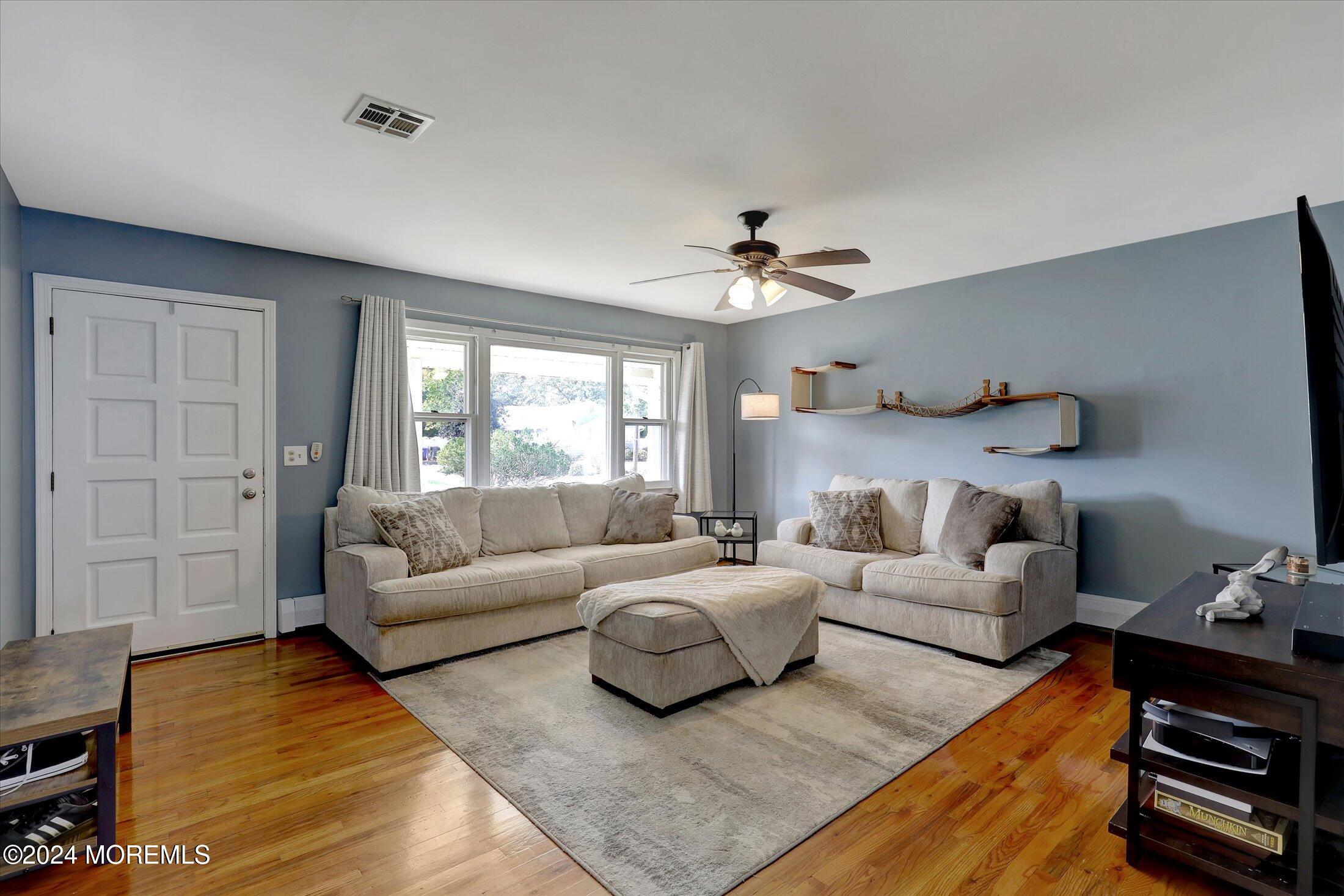 25 Hulse Landing Road Brick, NJ 08723 - Photo 5 of 28 a living room with furniture and a large window