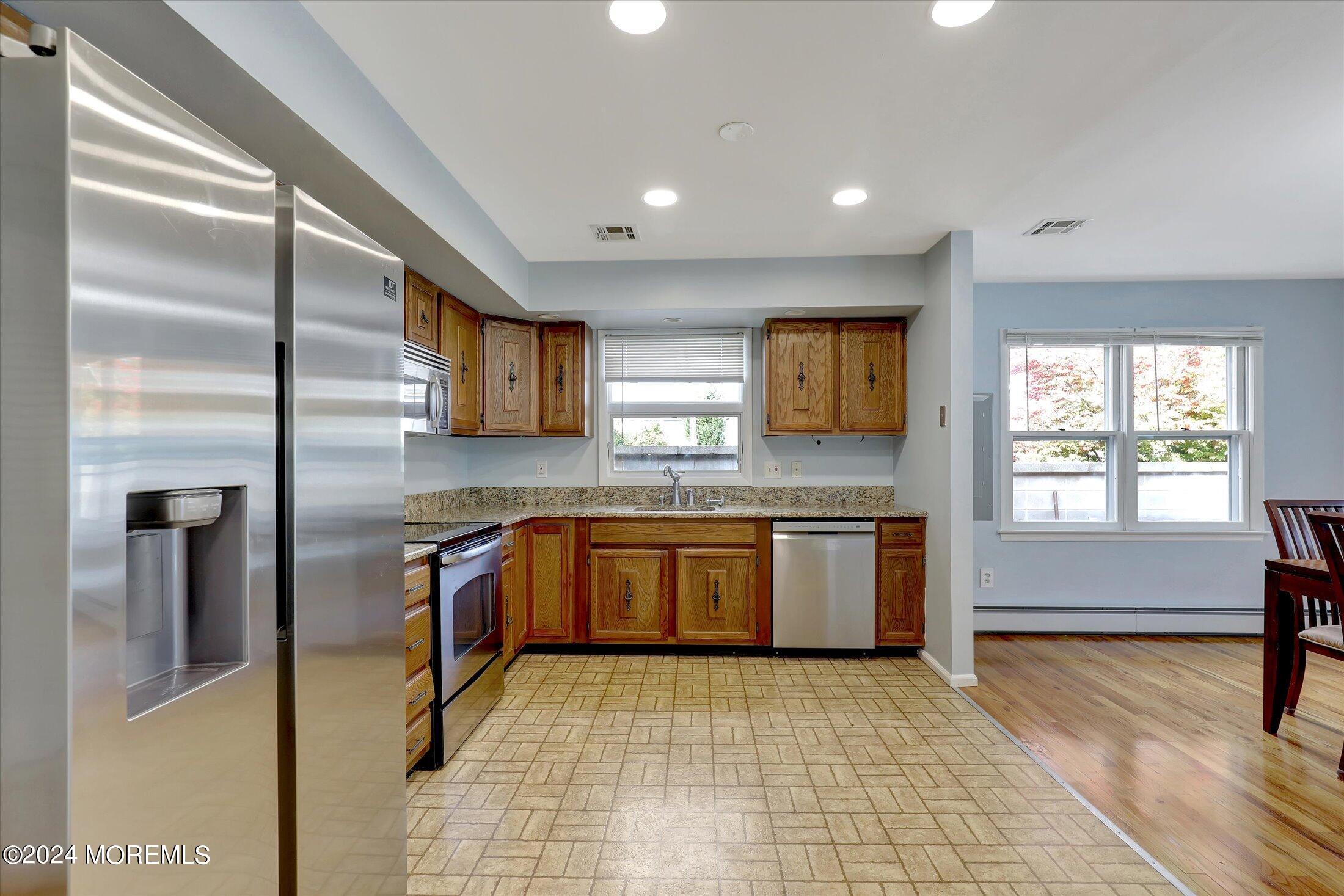 25 Hulse Landing Road Brick, NJ 08723 - Photo 7 of 28 a kitchen with stainless steel appliances granite countertop a sink stove and refrigerator