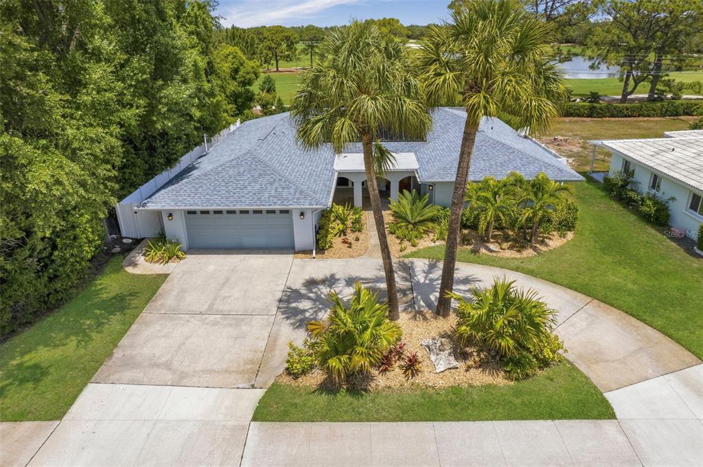 656 Mehlenbacher Road Belleair, FL 33756 - Photo 41 of 49 a view of a house with a yard