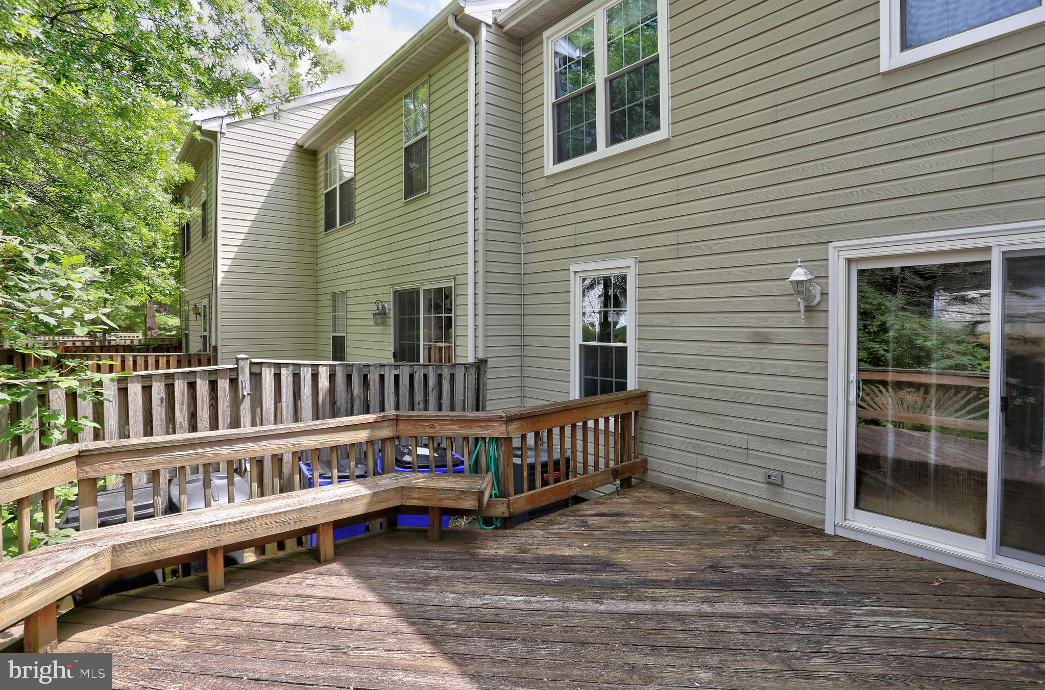6136 Starburn Path Columbia, MD 21045 - Photo 26 of 35 a view of a deck with a wooden fence