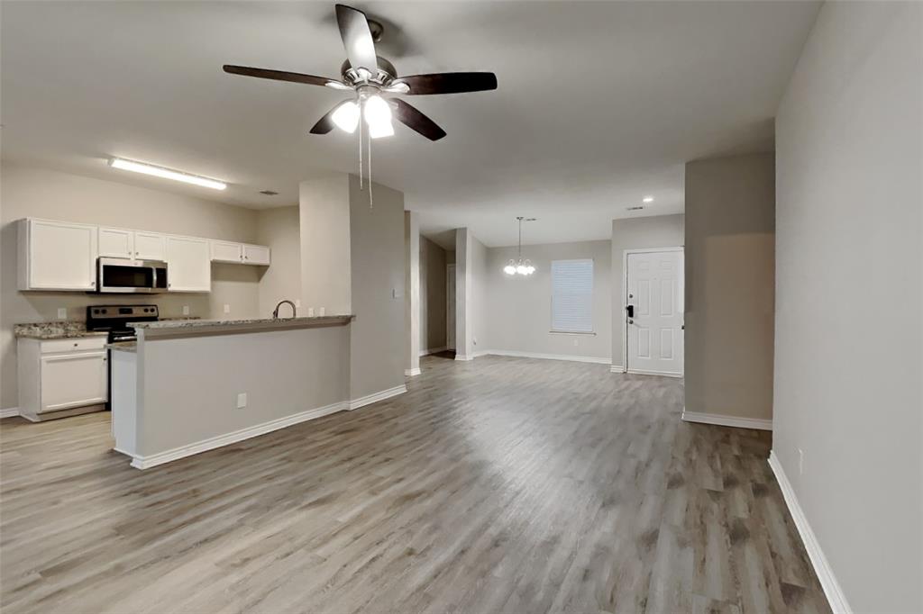 105 Independence Trail Forney, TX 75126 - Photo 3 of 18 a view of kitchen with sink microwave and stove