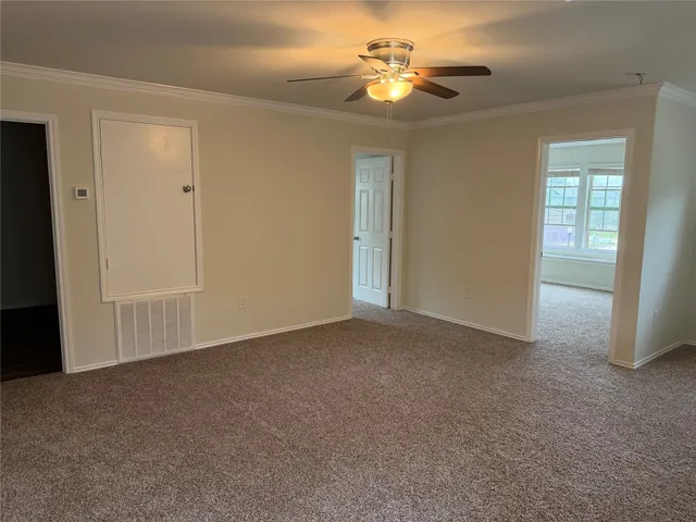 a view of empty room with windows