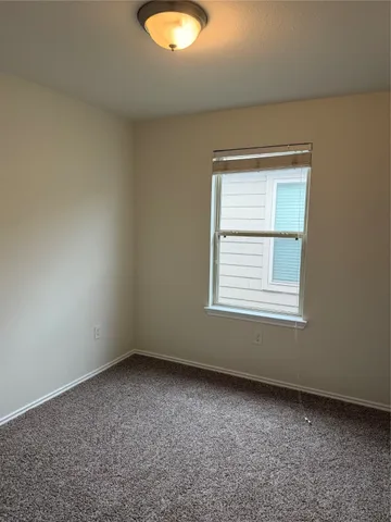 a view of room with wooden floor