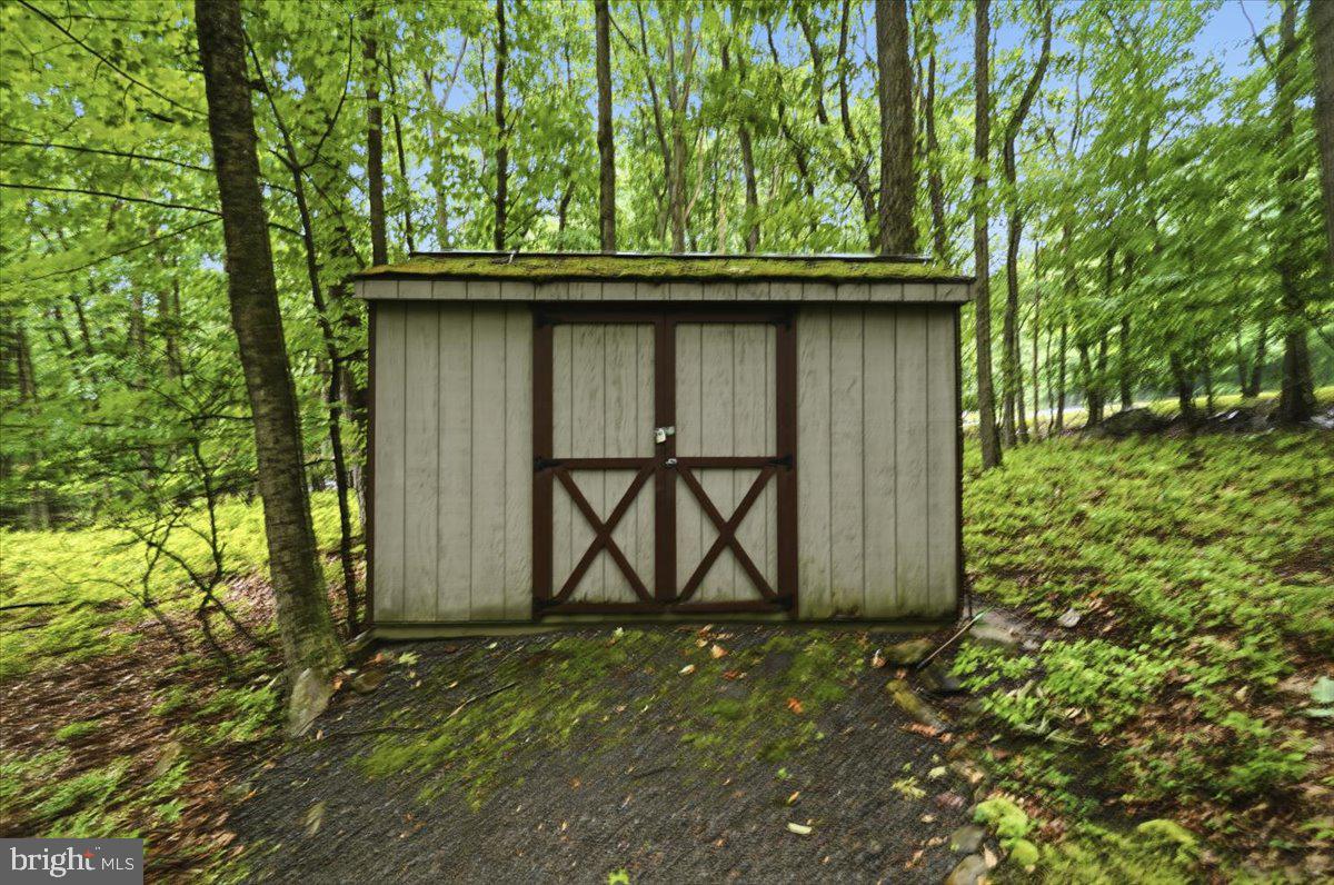 177 Jay Effort, PA 18330 - Photo 36 of 47 Charming shed nestled in lush greenery.