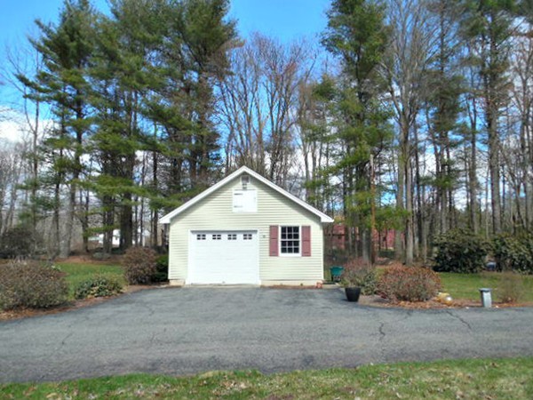 20 Farrington Road Barre, MA 01005 - Photo 3 of 28 a front view of a house with a yard and garage