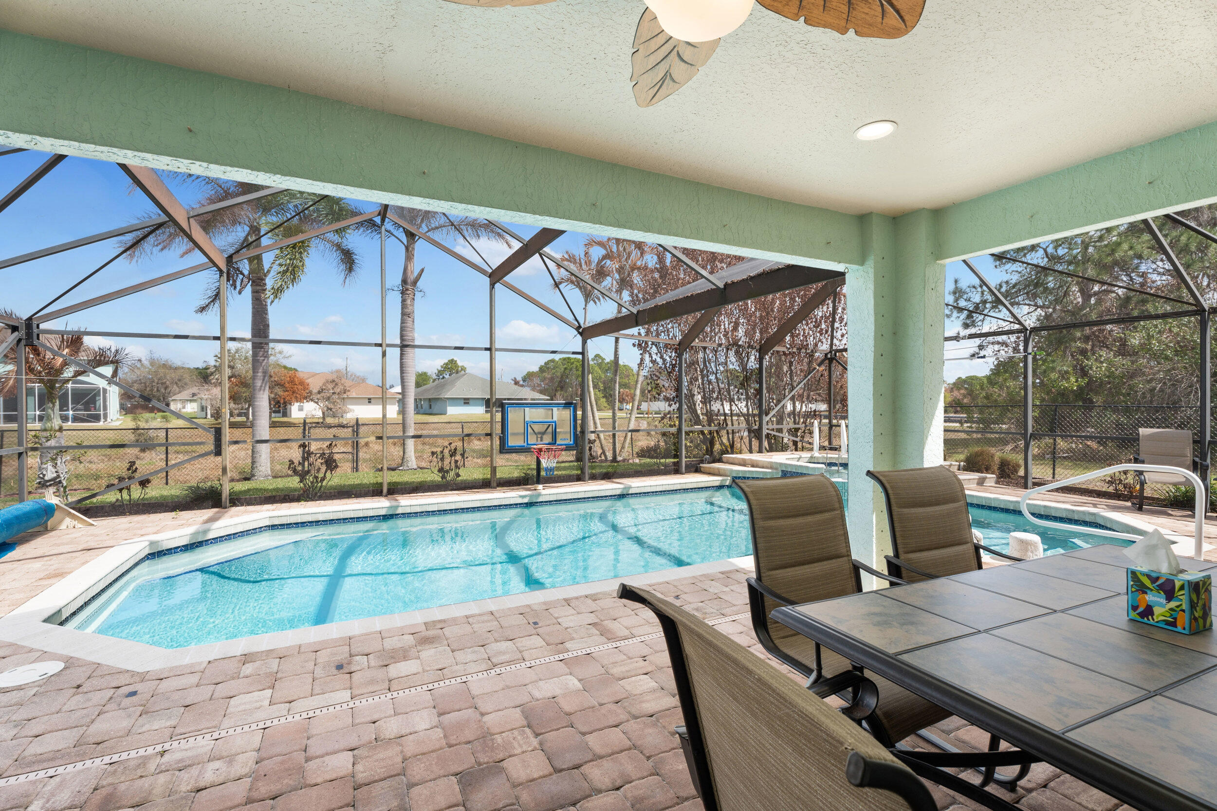 5593 Northwest Wesley Road Port St. Lucie, FL 34986 - Photo 22 of 33 Covered patio and heated pool
