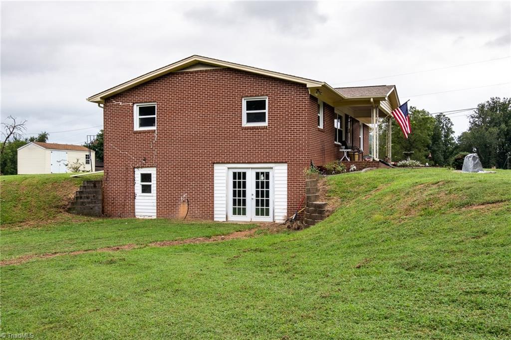 3230 Old 60 Ronda, NC 28670 - Photo 22 of 24 Side view of home looking toward French doors leading to basement.