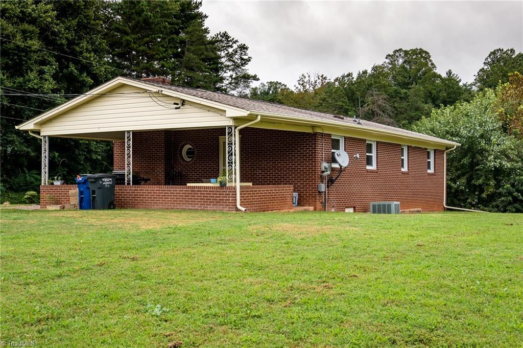 Side/rear view of home. Roof installed in 2018 and new windows in 2010. 
