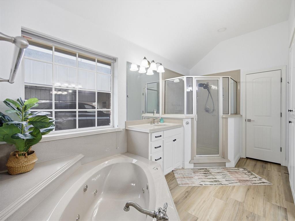 1161 County Road 2175 Decatur, TX 76234 - Photo 13 of 20 a spacious bedroom with a bed and a large window