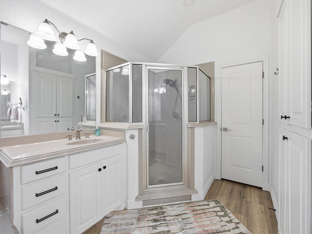 1161 County Road 2175 Decatur, TX 76234 - Photo 14 of 20 a bathroom with a shower a sink and a mirror