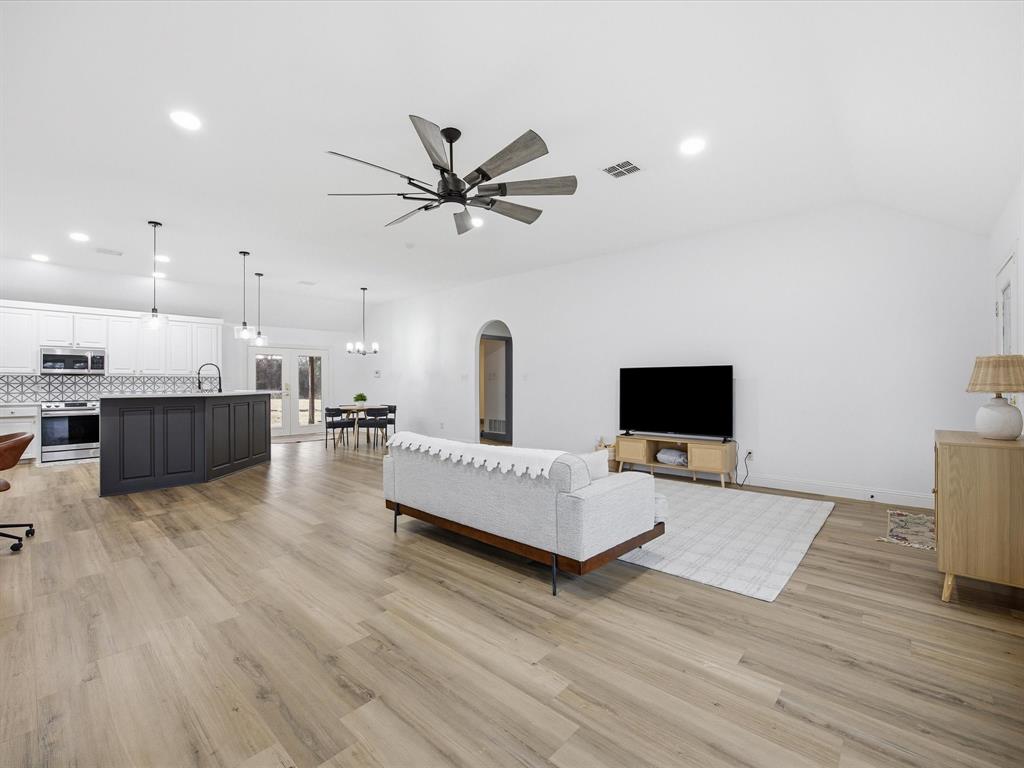 1161 County Road 2175 Decatur, TX 76234 - Photo 5 of 20 a living room with furniture and a flat screen tv