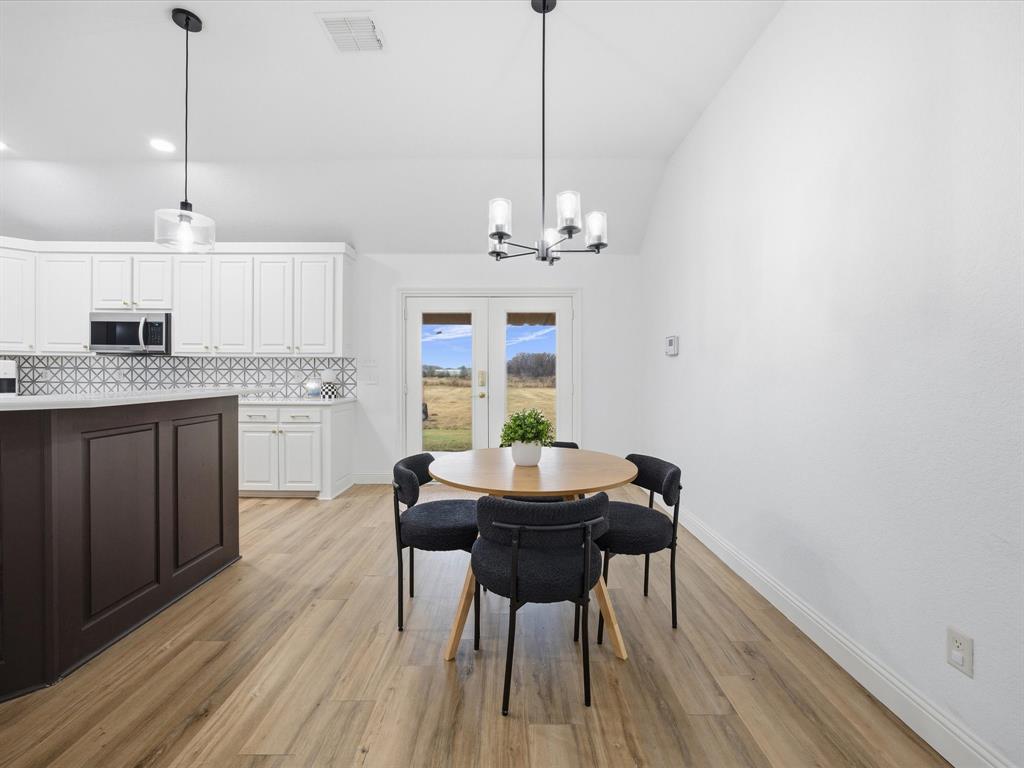 1161 County Road 2175 Decatur, TX 76234 - Photo 8 of 20 a view of a dining room with furniture window and wooden floor