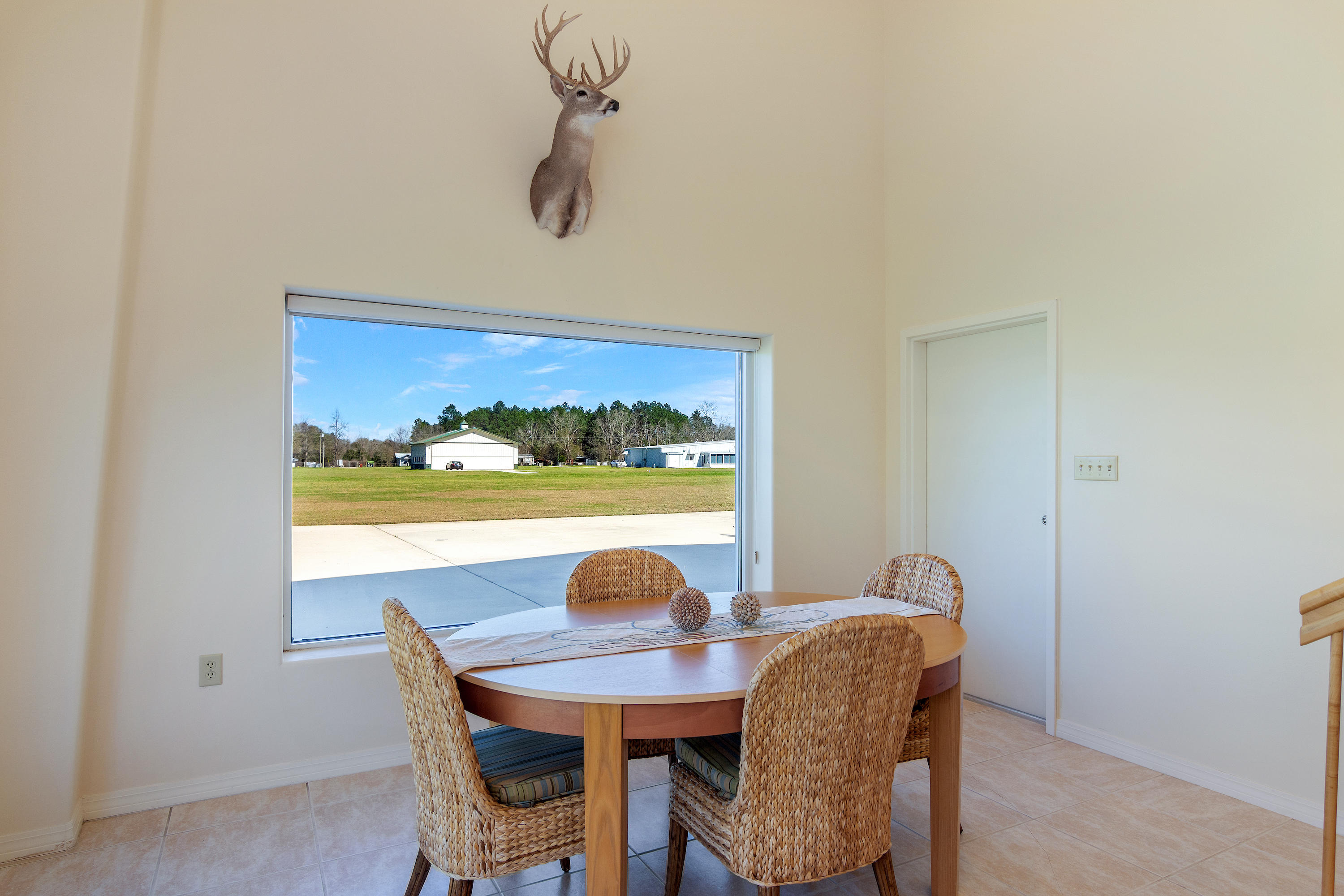 1447 Sky Ranch Lane Baker, FL 32531 - Photo 13 of 43 a view of a dining room with furniture window and wooden floor