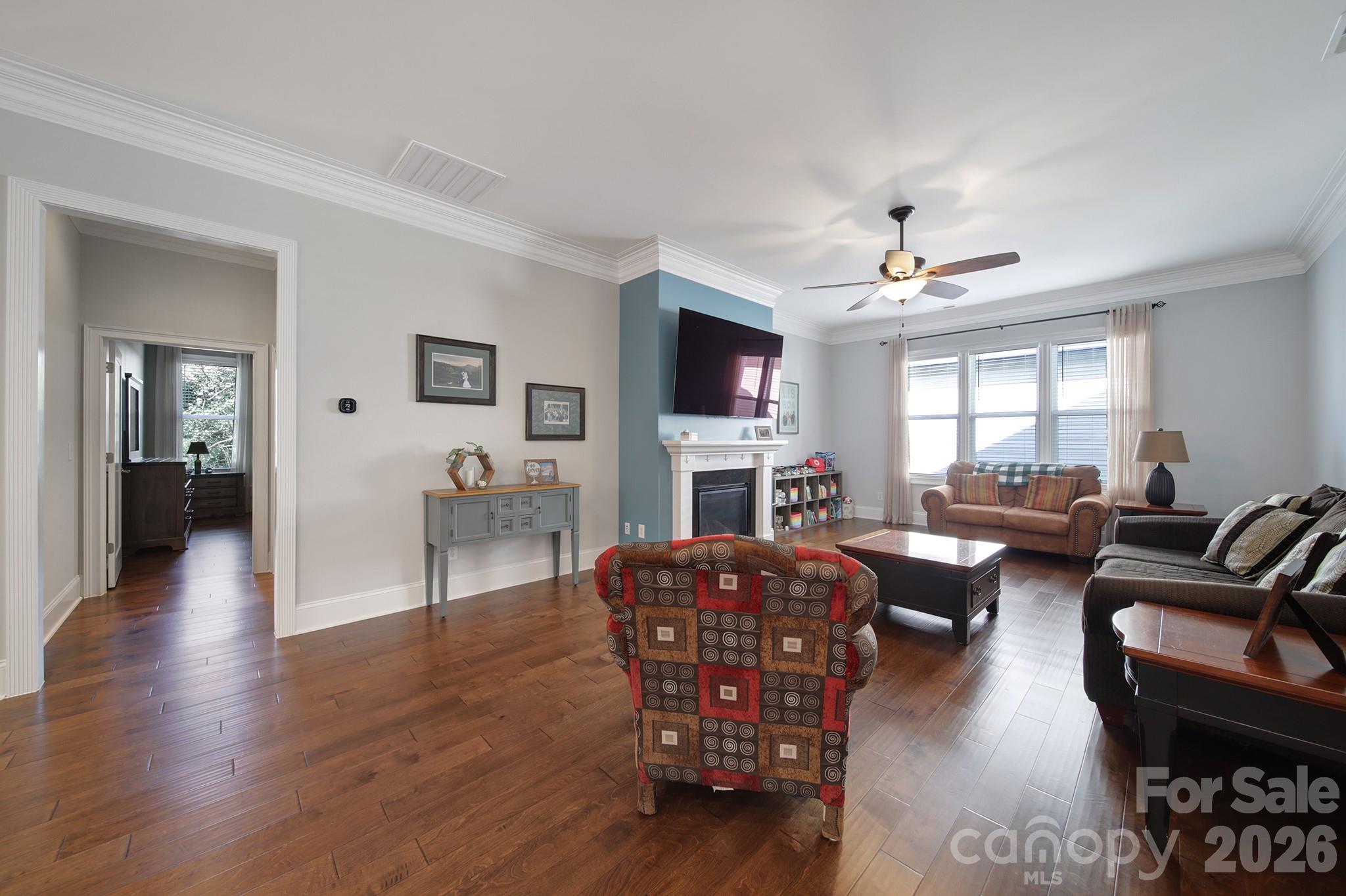 1633 Half Pint Loop Fort Mill, SC 29708 - Photo 8 of 48 a living room with fireplace furniture and a wooden floor