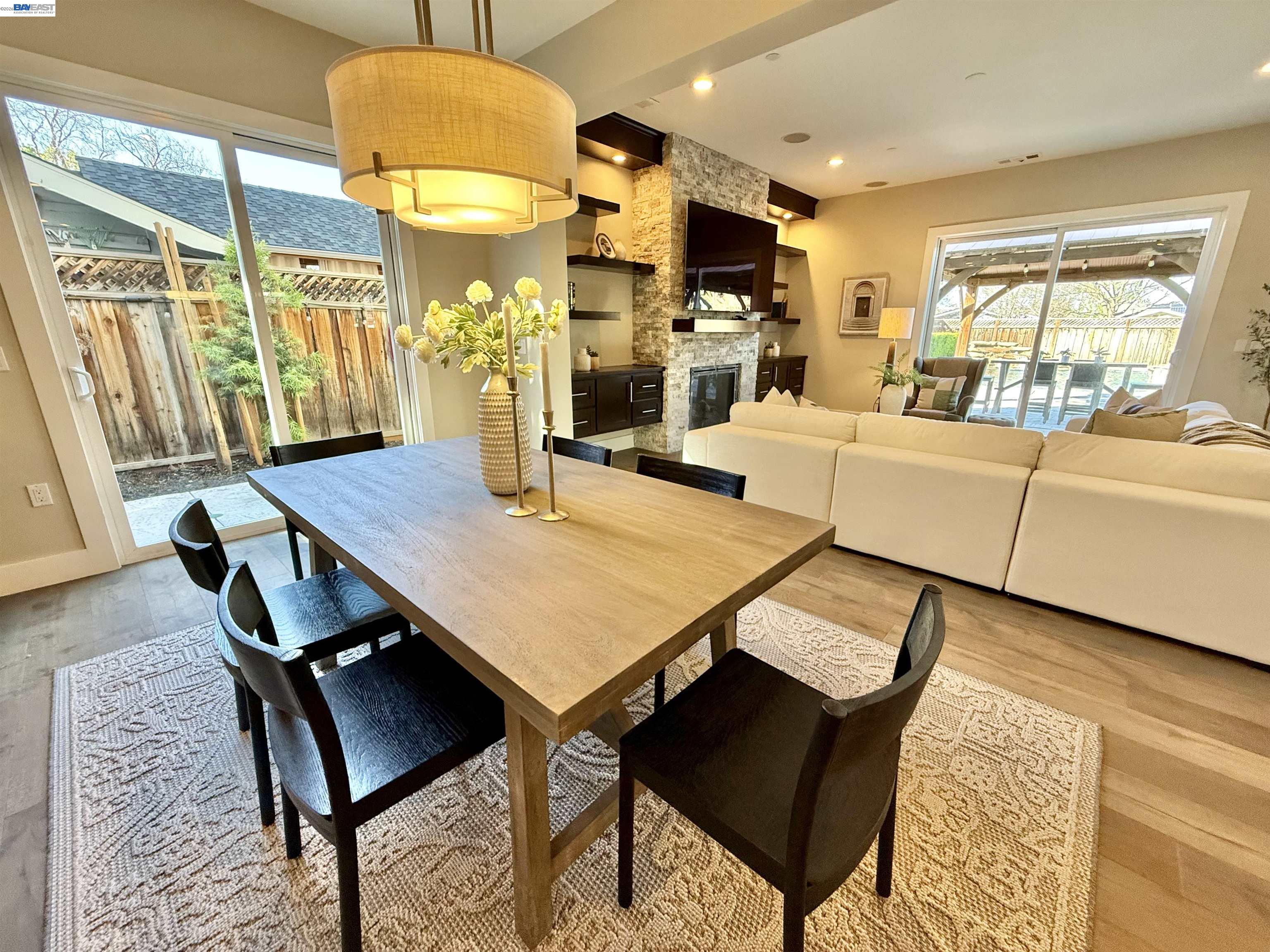 1500 Arroyo Road Livermore, CA 94550 - Photo 16 of 58 a living room with dining table furniture and a chandelier