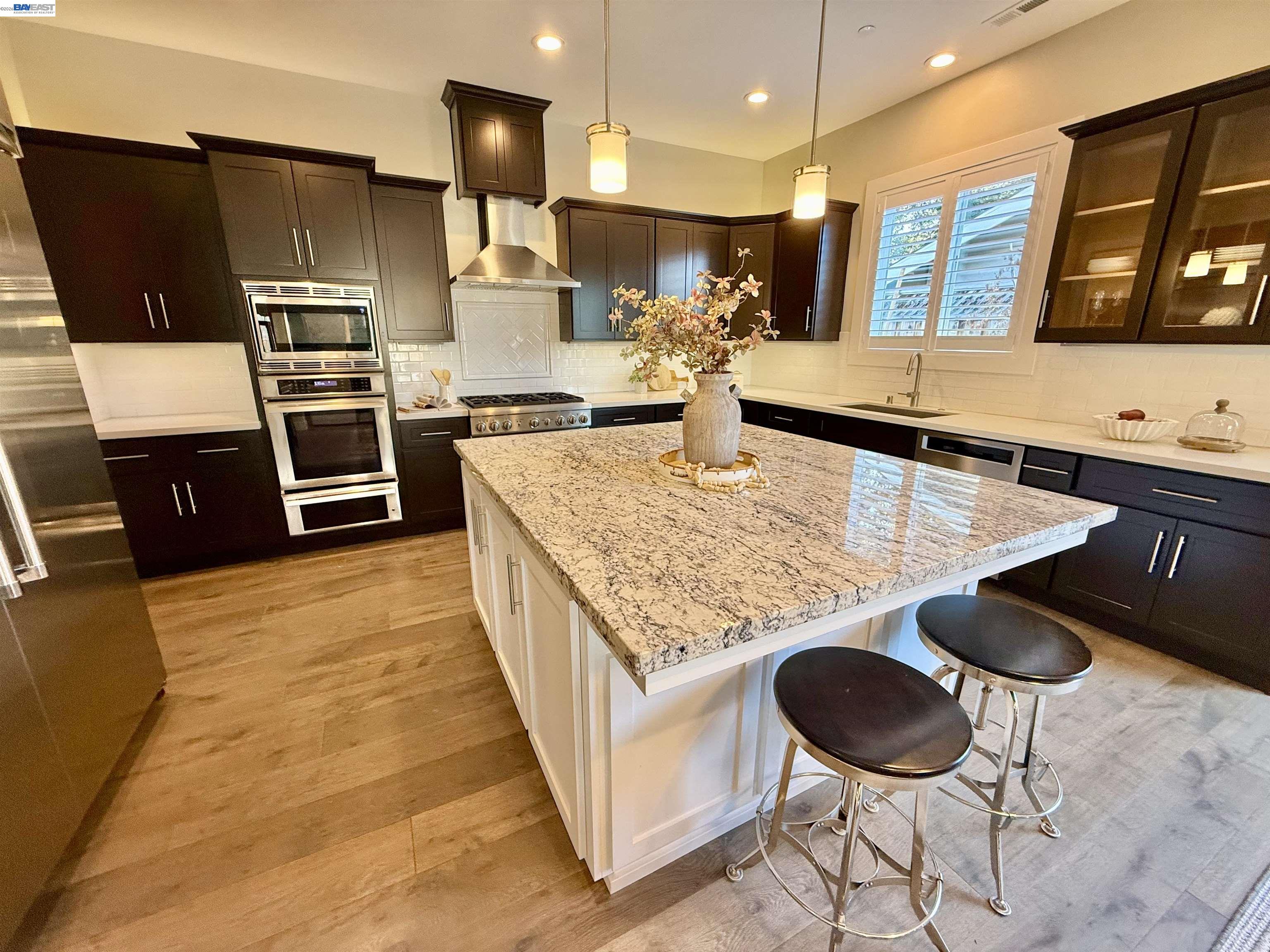 1500 Arroyo Road Livermore, CA 94550 - Photo 24 of 58 a kitchen with stainless steel appliances granite countertop a sink counter space and cabinets