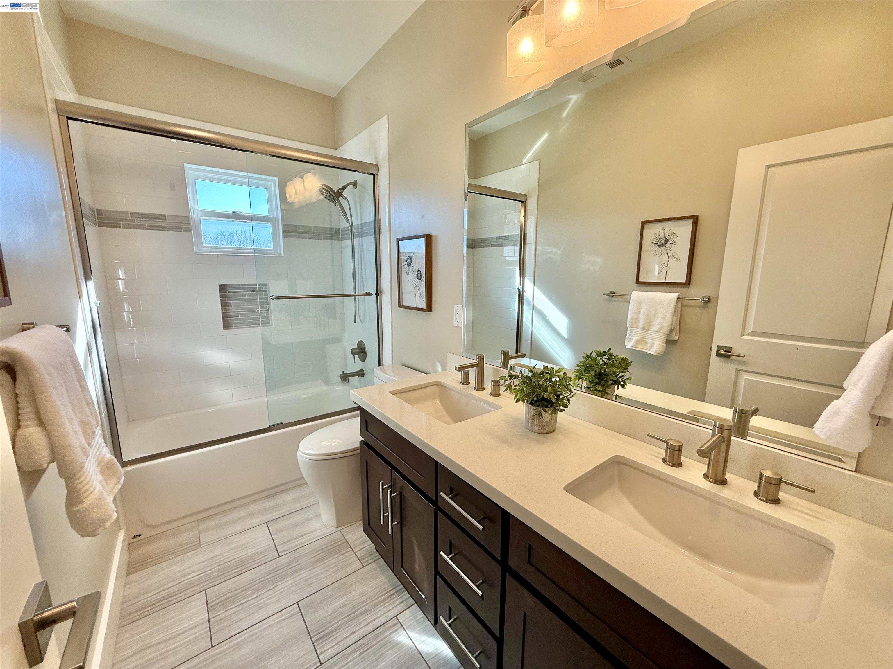 1500 Arroyo Road Livermore, CA 94550 - Photo 43 of 58 a bathroom with a double vanity sink mirror and shower