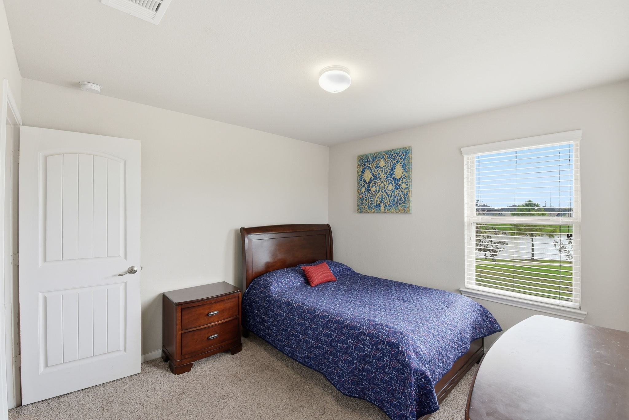 1502 City Lake Place Houston, TX 77047 - Photo 25 of 36 a bedroom with a large bed and a window