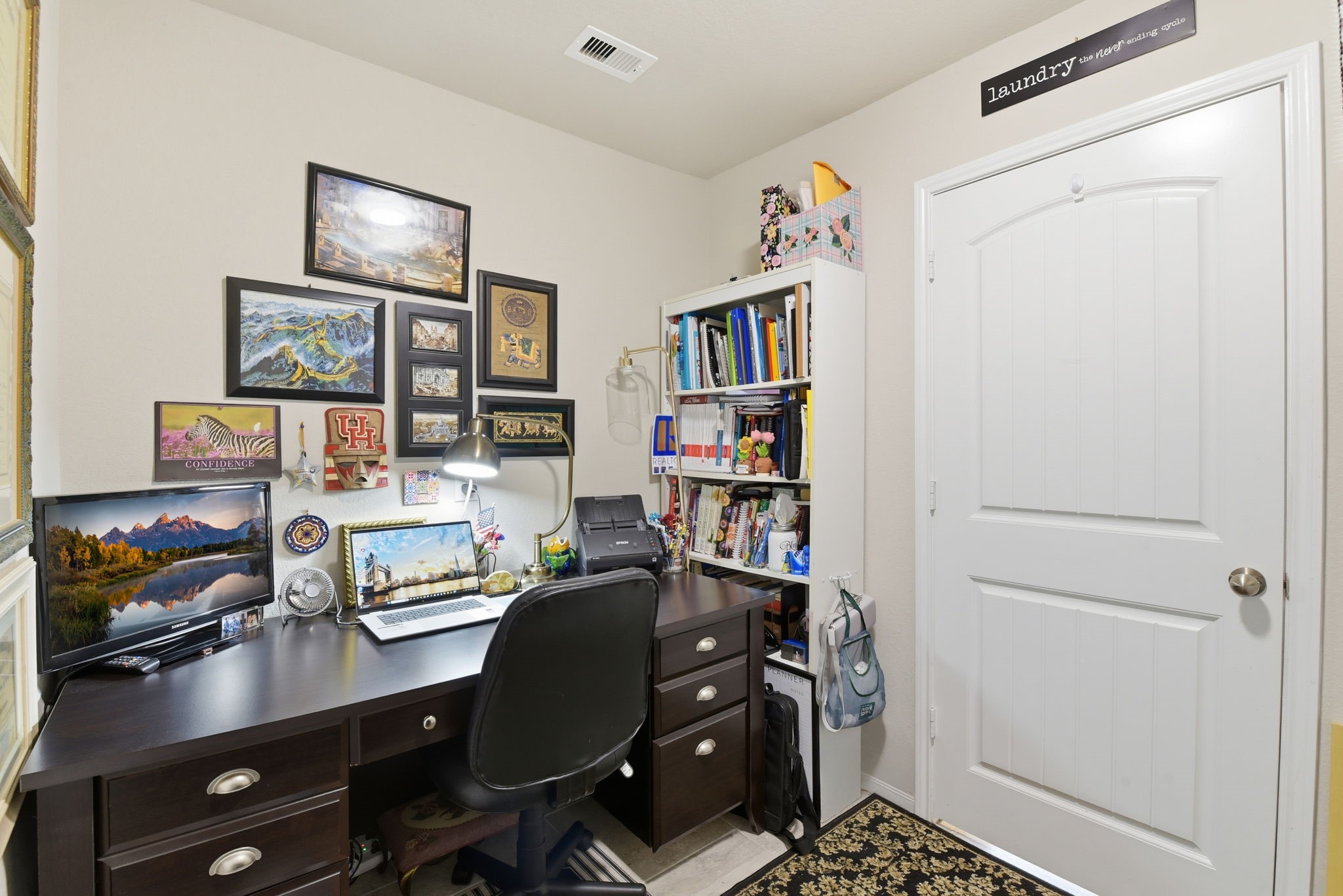 1502 City Lake Place Houston, TX 77047 - Photo 30 of 36 a view of a workspace with furniture and bookshelf