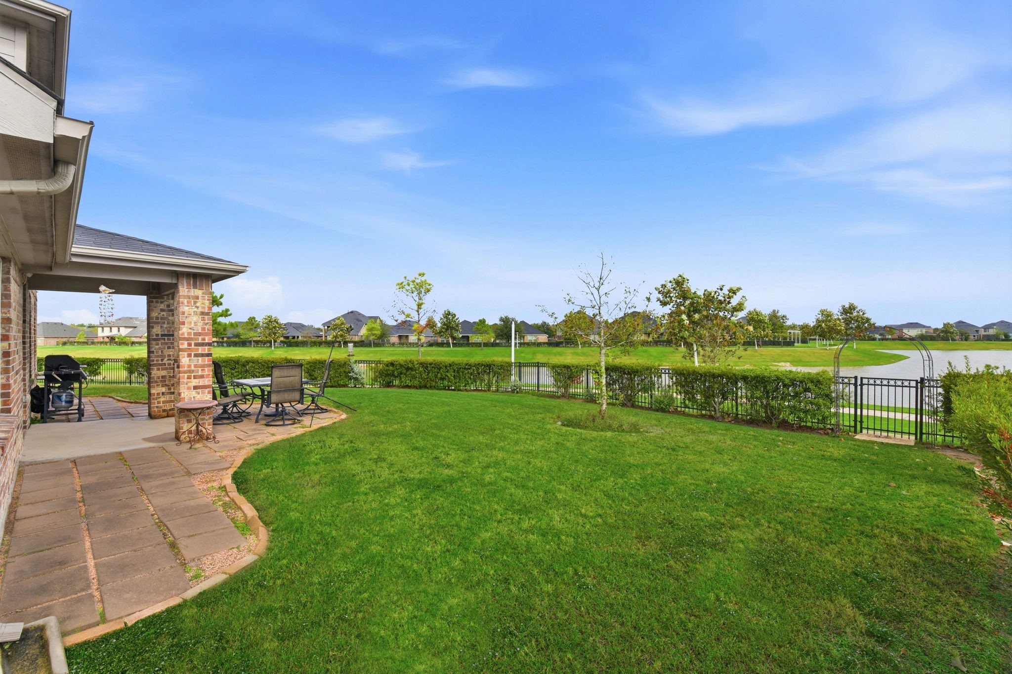 1502 City Lake Place Houston, TX 77047 - Photo 32 of 36 a view of a house with backyard porch and garden