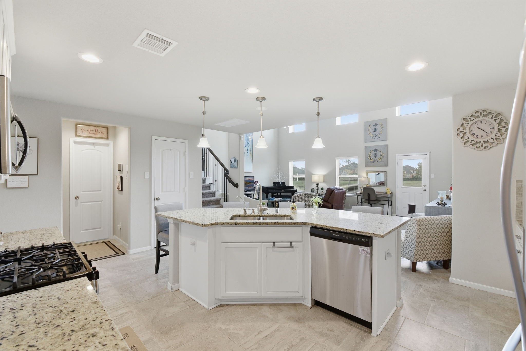 1502 City Lake Place Houston, TX 77047 - Photo 7 of 36 a kitchen with a sink a stove a refrigerator and a cabinets