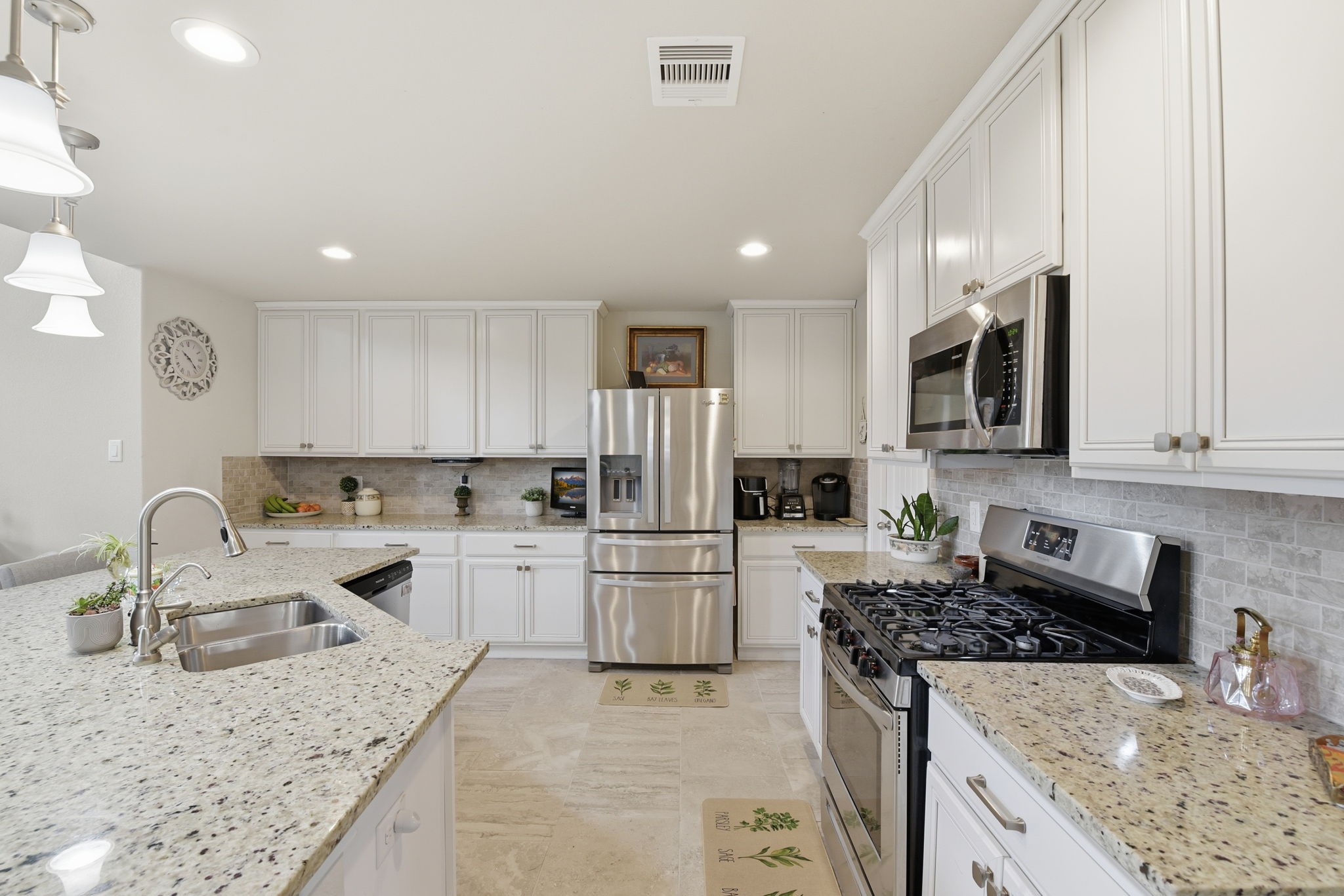 1502 City Lake Place Houston, TX 77047 - Photo 8 of 36 a kitchen with a sink stove and refrigerator