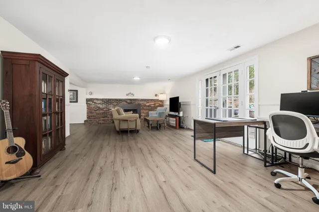 a bedroom with a bed and a lamp