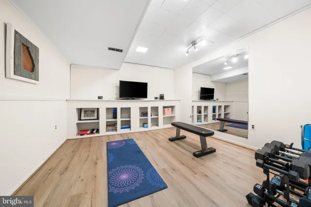 a view of a patio with table and chairs and potted plants