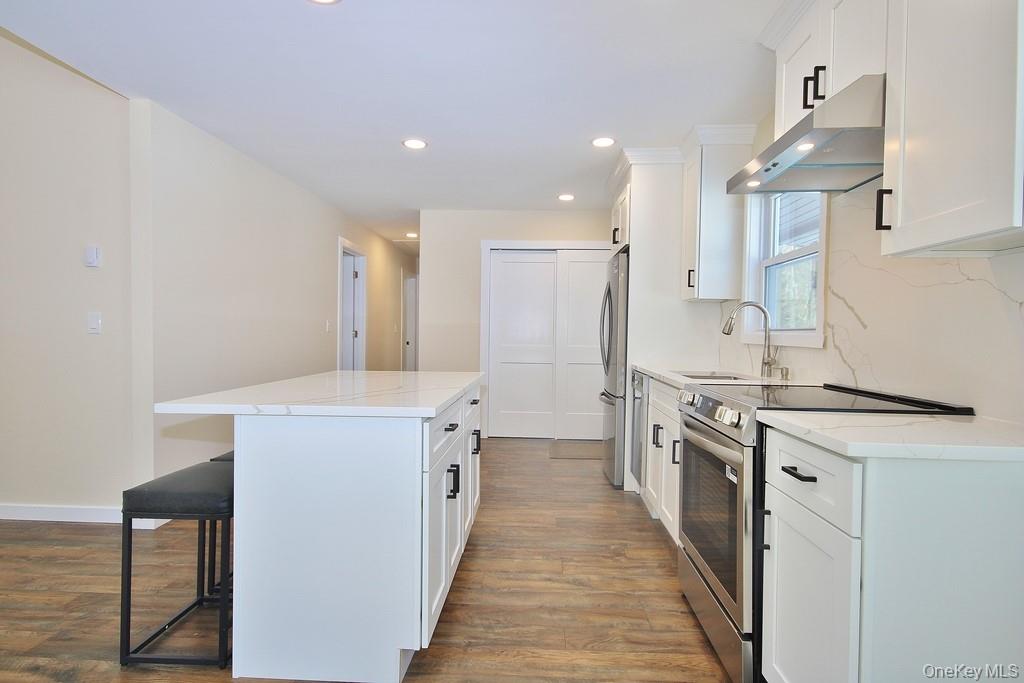 6 Buck Hill Road Wurtsboro, NY 12790 - Photo 18 of 43 a kitchen with stainless steel appliances a sink stove and cabinets
