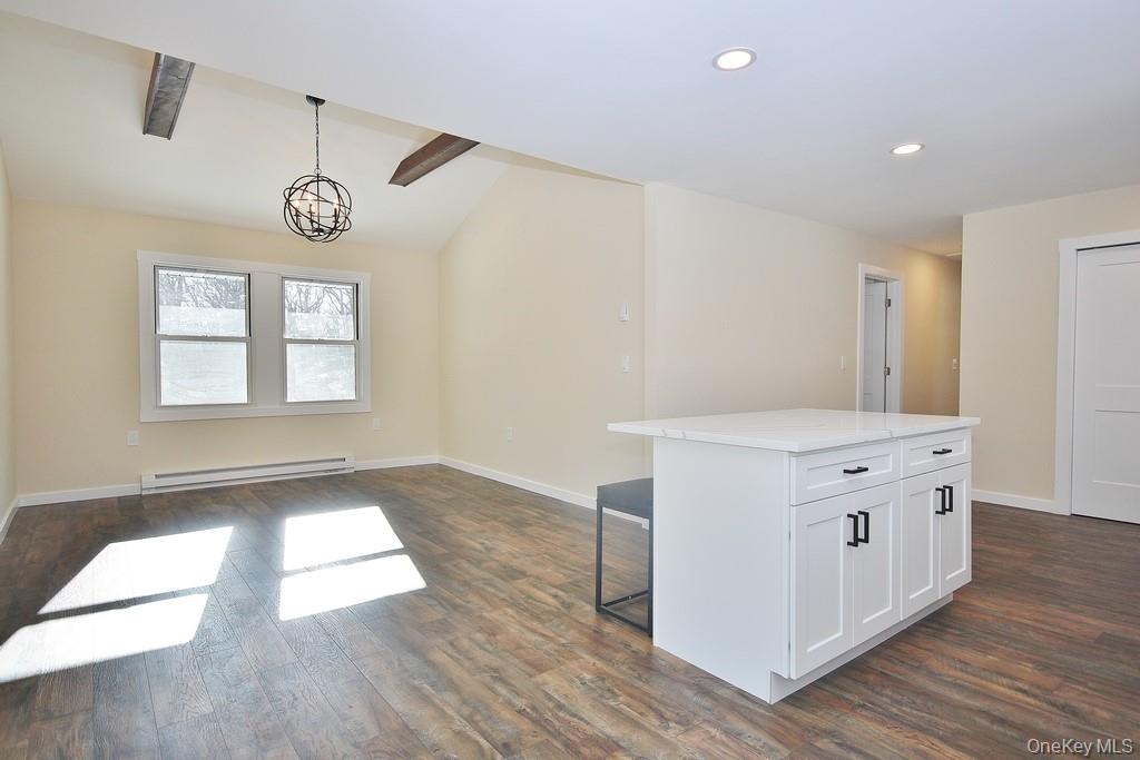 6 Buck Hill Road Wurtsboro, NY 12790 - Photo 43 of 43 a kitchen with a stove and wooden floor