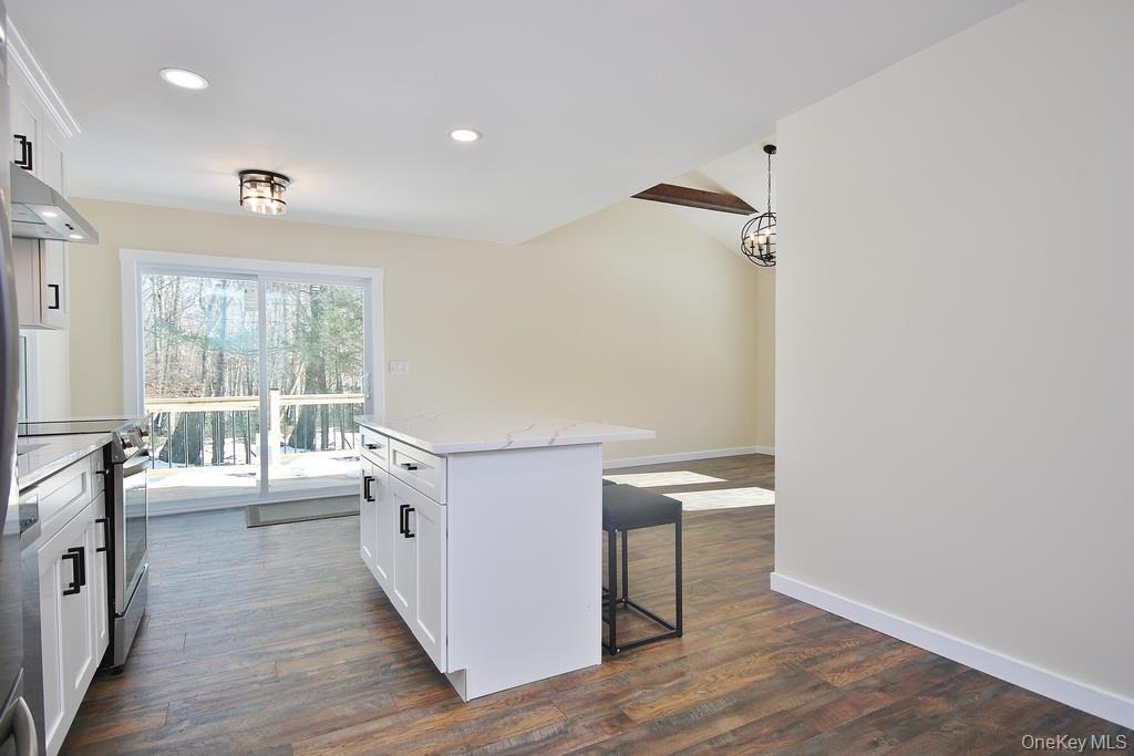 6 Buck Hill Road Wurtsboro, NY 12790 - Photo 19 of 43 a hallway with a white furniture a wooden floor and a large window