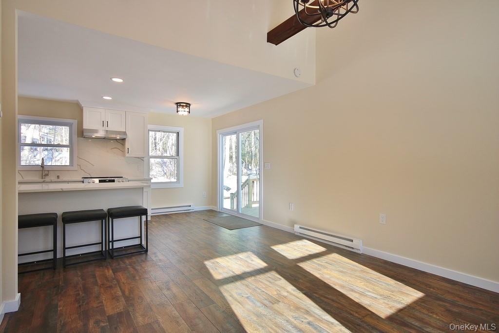 6 Buck Hill Road Wurtsboro, NY 12790 - Photo 22 of 43 a room with wooden floor and window