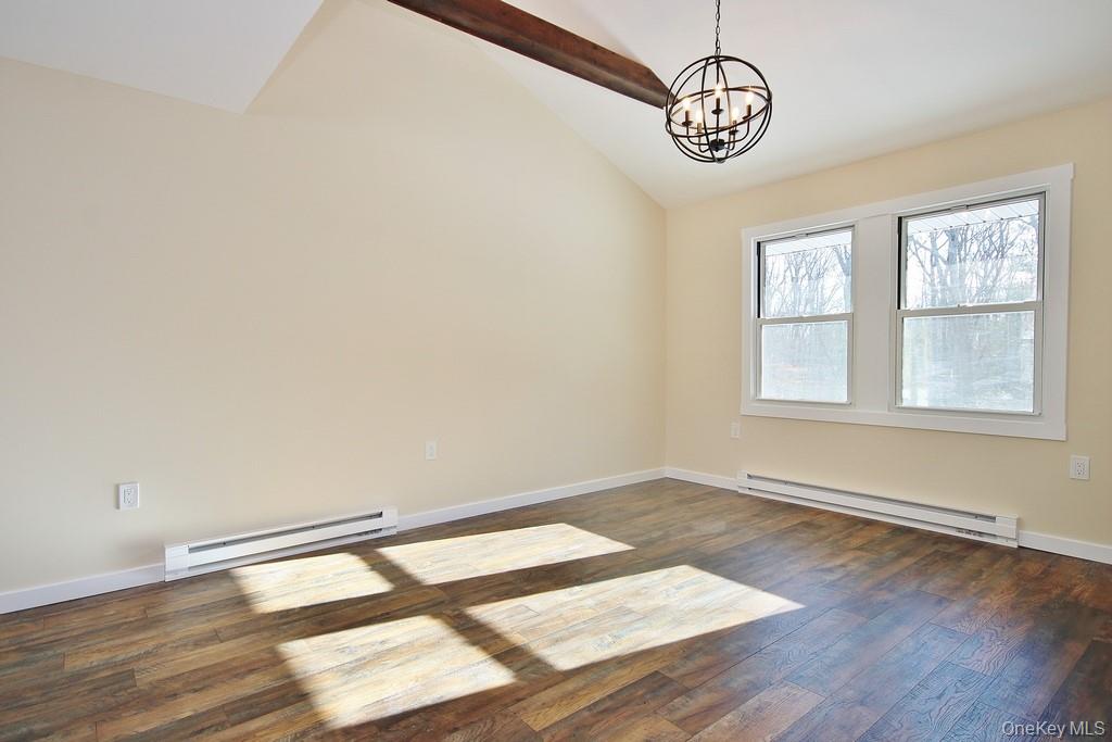 6 Buck Hill Road Wurtsboro, NY 12790 - Photo 24 of 43 an empty room with wooden floor fan and windows