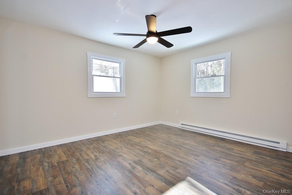 6 Buck Hill Road Wurtsboro, NY 12790 - Photo 29 of 43 a view of an empty room with wooden floor and a window