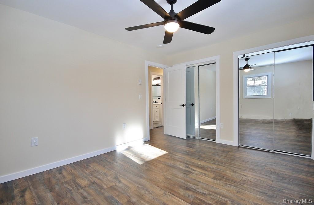 6 Buck Hill Road Wurtsboro, NY 12790 - Photo 31 of 43 wooden floor in an empty room with a window