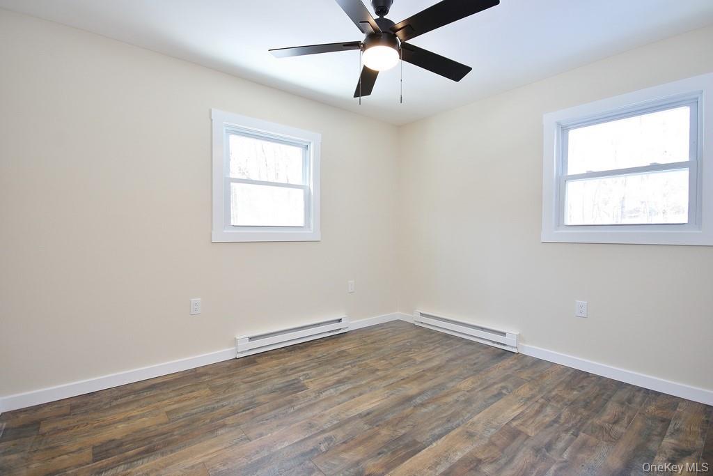 6 Buck Hill Road Wurtsboro, NY 12790 - Photo 34 of 43 wooden floor in an empty room with a window