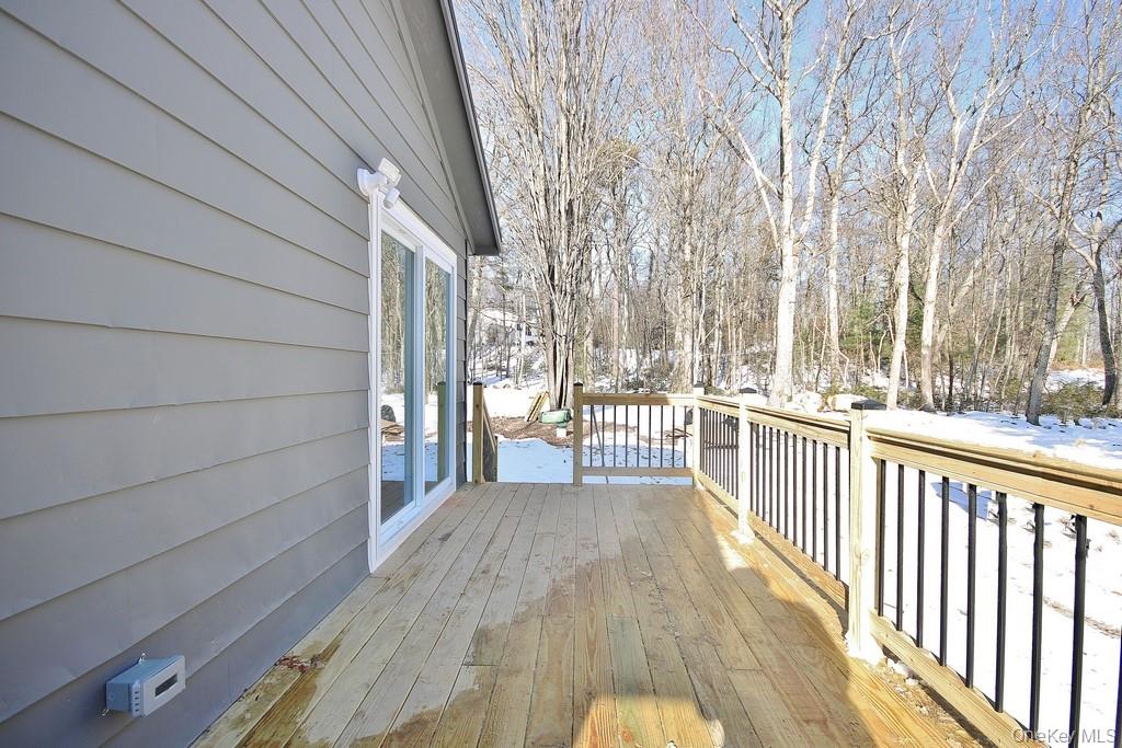 6 Buck Hill Road Wurtsboro, NY 12790 - Photo 7 of 43 a view of a balcony with wooden floor and fence