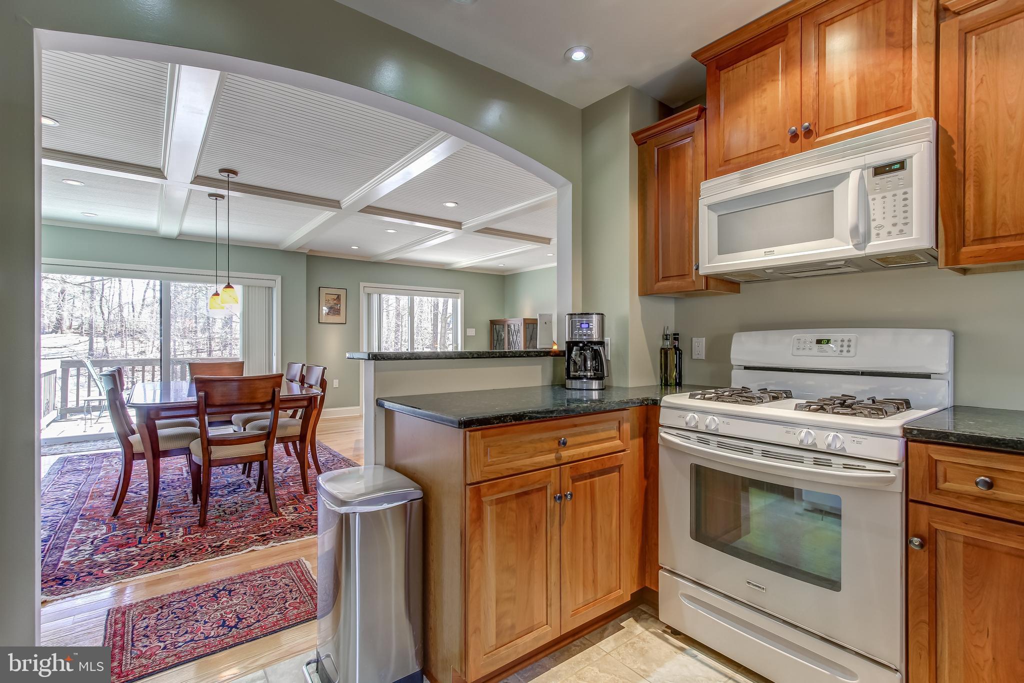 8120 Inverness Ridge Road Potomac, MD 20854 - Photo 12 of 42 a kitchen with a stove a sink and chairs