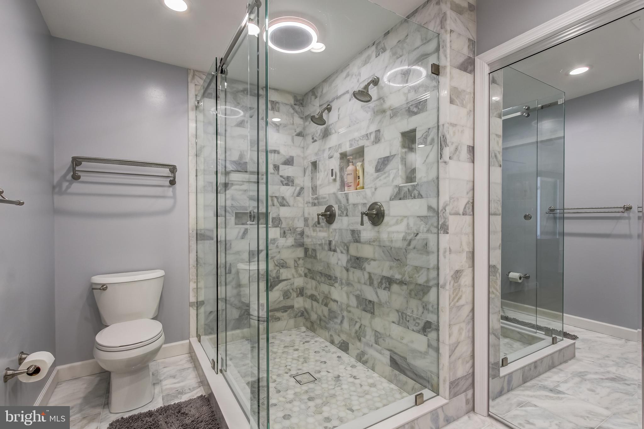 8120 Inverness Ridge Road Potomac, MD 20854 - Photo 30 of 42 a bathroom with a toilet and a shower