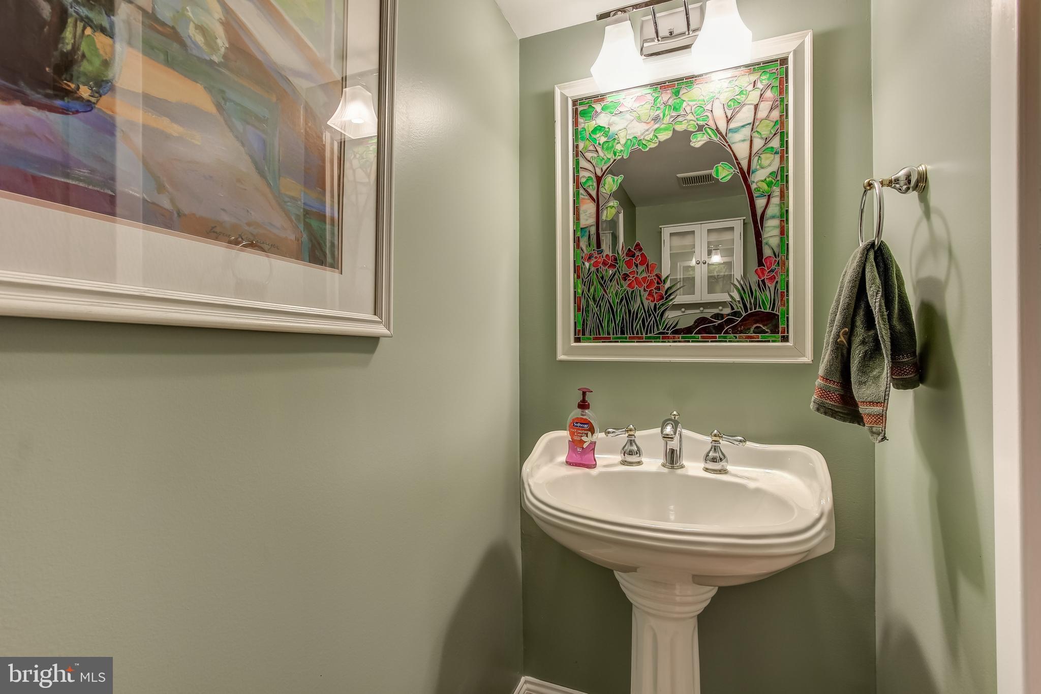 8120 Inverness Ridge Road Potomac, MD 20854 - Photo 33 of 42 a bathroom with a sink and a mirror