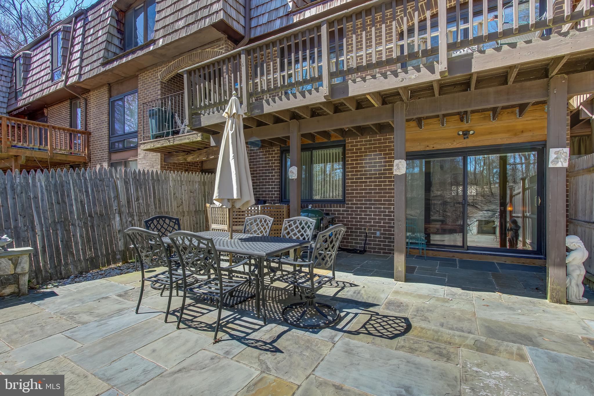 8120 Inverness Ridge Road Potomac, MD 20854 - Photo 39 of 42 a view of a building with table and chairs