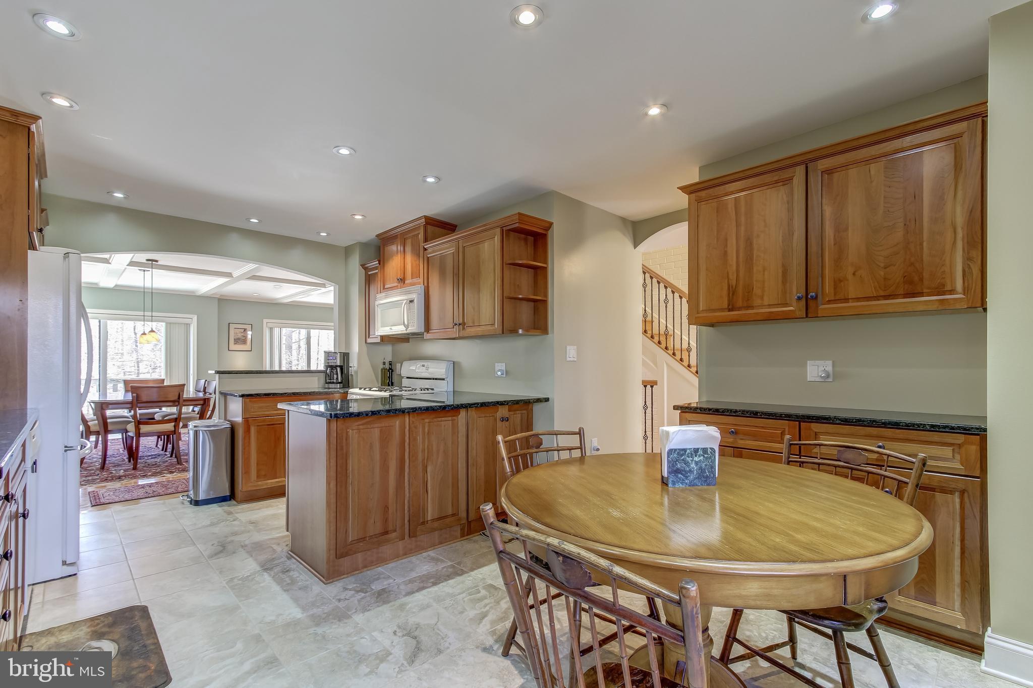 8120 Inverness Ridge Road Potomac, MD 20854 - Photo 8 of 42 a kitchen with a table and chairs in it