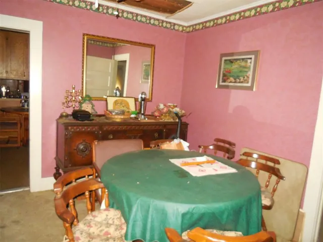 a bed room with a bed and a mirror