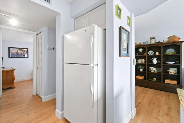 a white refrigerator freezer sitting in a kitchen