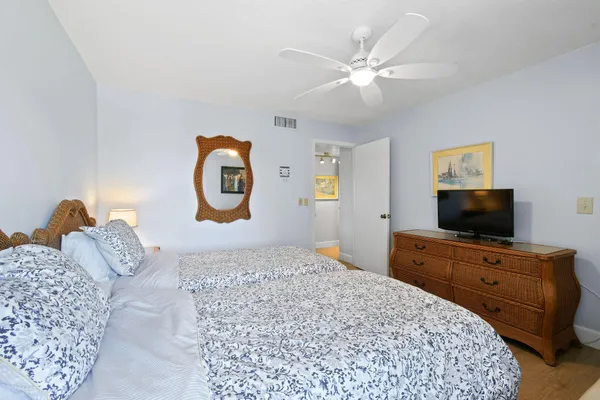 a bedroom with a bed and a television